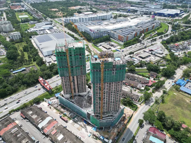 Drone photograph of the A-SOHO towers under construction above Johor Jaya.