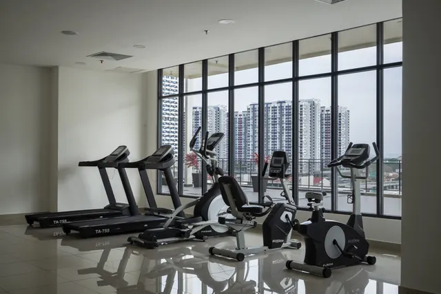 Gymnasium at Asteria Melaka with floor-to-ceiling glazing.