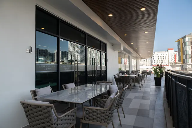 Covered terrace dining area at Asteria Melaka overlooking the city.